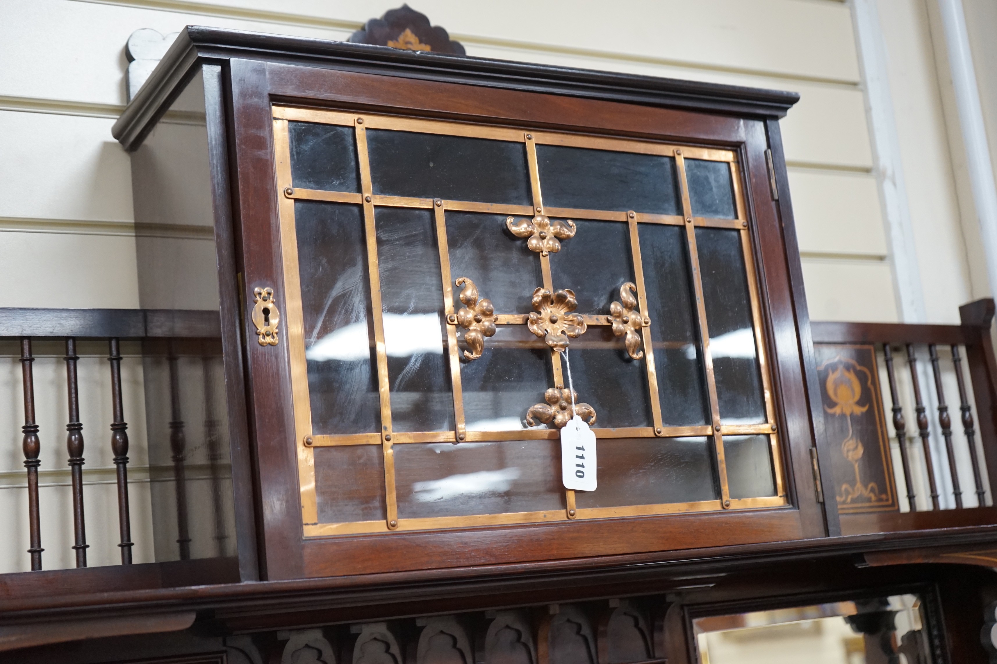 An Arts & Crafts marquetry inlaid mahogany amaryllis pattern side cabinet, in the manner of Shapland & Petter